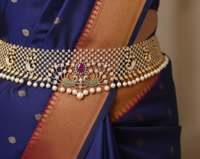 Exquisite waistband is meticulously crafted with shimmering CZ stones
