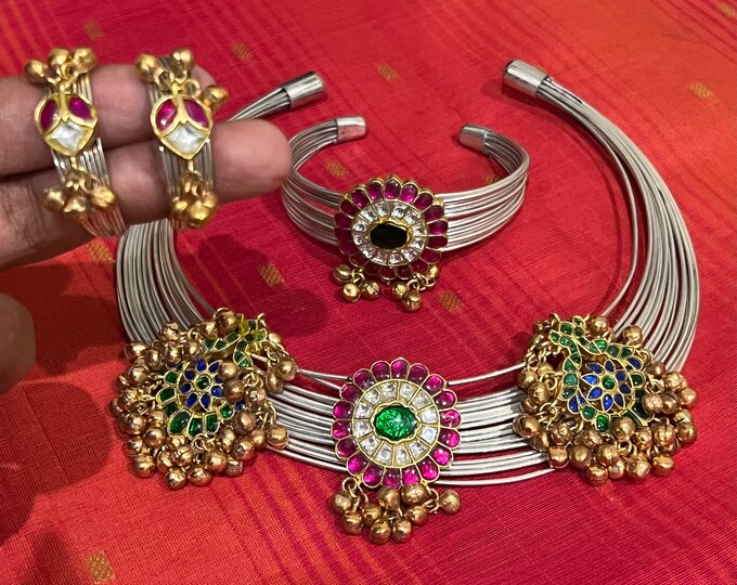 Beautiful silver look alike grand looking Jadau  husli  with earrings and bracelet