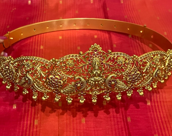 Exquisite Goddess Lakshmi nakshi waistband is meticulously crafted with shimmering  stones and gold color beads and pearls