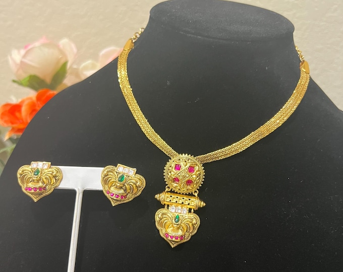 Elegant Gold-Plated Necklace with Intricate Pendant and Matching Earrings, Adorned with  Ruby, and Emerald Stones