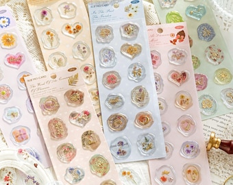 May include: A set of 10 clear sticker sheets with floral designs and gold accents. Each sheet features a different theme, such as "Flower Blossoming Event", "The Wood of the Covenant of Flowers", and "In the Past the Garden".