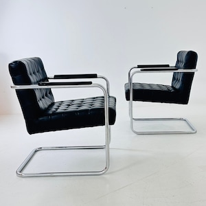 Set of tow Bauhaus black leather loung chairs 1980s