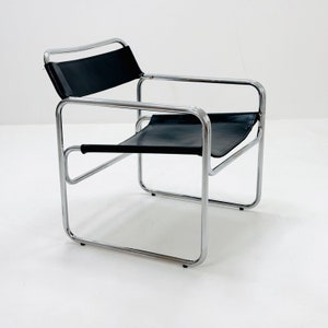 May include: A chrome and black leather chair with a simple, modern design.