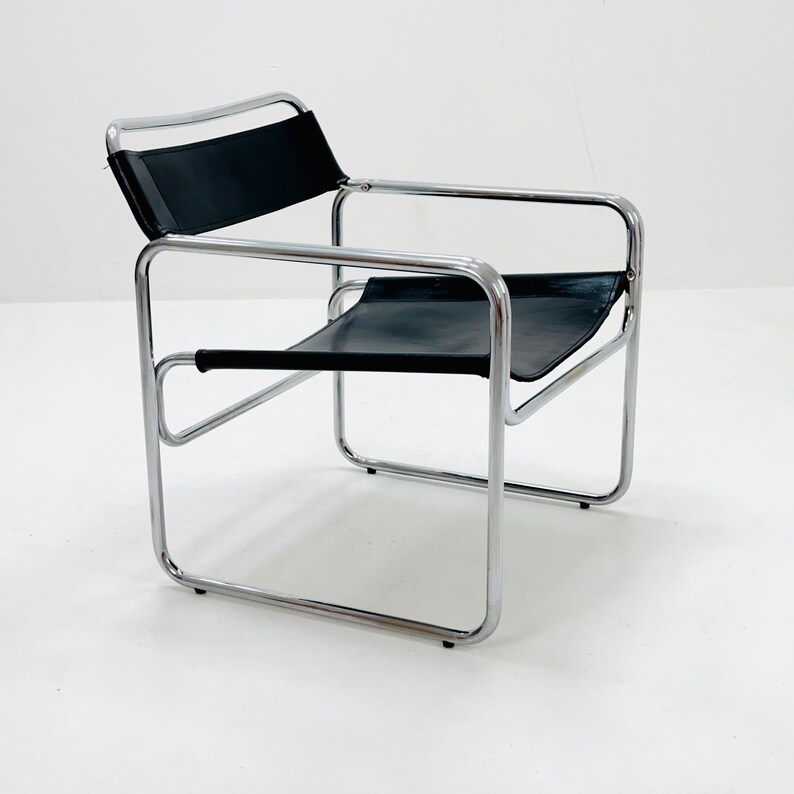 May include: A chrome and black leather chair with a simple, modern design.