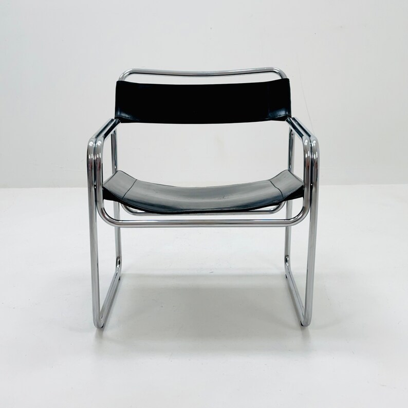 May include: A chrome and black leather chair with a simple, modern design.
