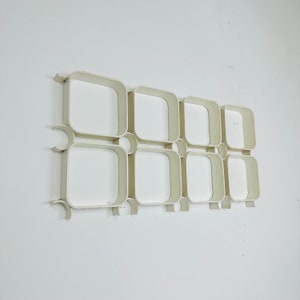 1 of 2 White Space Age plastic wall shelves, 1970s.