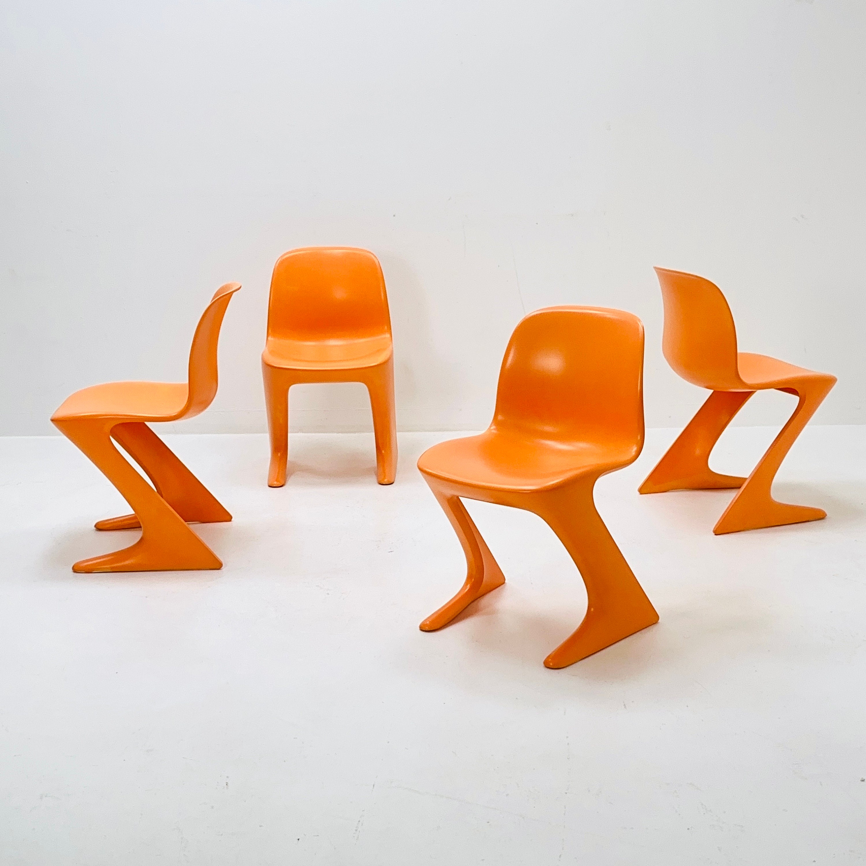 Set of 4 Space Age Orange “kangaroo” Chairs by Ernst Moeckl