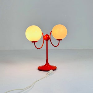 Opaline glass, orange tulip shaped base makes this stunning space age mid century table lamp . Made by Kaiser Leuchten, Germany 1970s