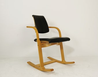 Vintage black leather rocking chair by Peter Opsvik for Stokke Norway, 1980s