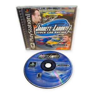 May include: A PlayStation video game case and disc for Jarrett & Labonte Stock Car Racing. The cover features two race cars, portraits of two drivers with signatures, and the title text. The blue disc displays the game title, logo, and rating.