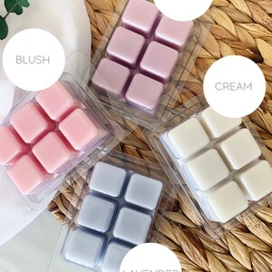 May include: Four packs of wax melts in different colors and scents. The scents are labeled "Blush", "Purple", "Cream", and "Lavender".