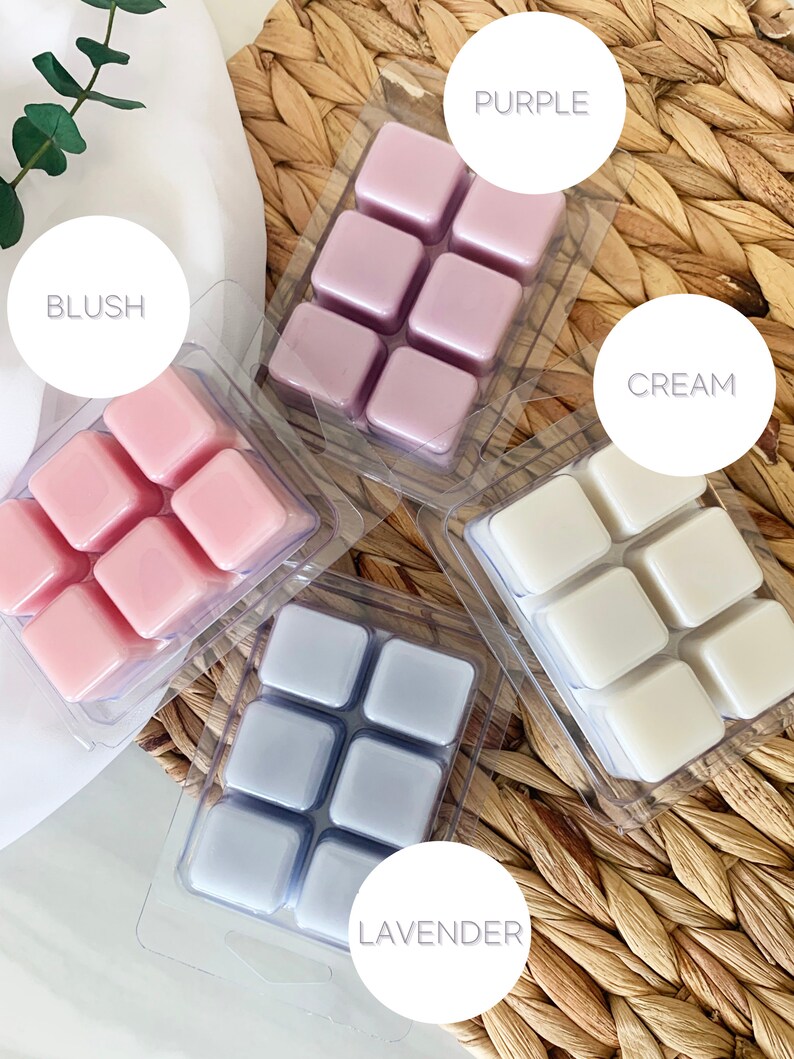 May include: Four packs of wax melts in different colors and scents. The scents are labeled "Blush", "Purple", "Cream", and "Lavender".