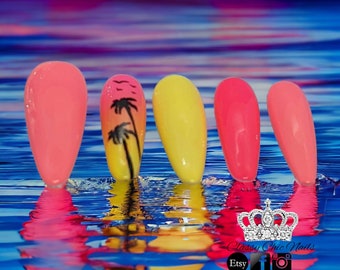 May include: Five almond-shaped press-on nails featuring a vibrant summer theme. The set includes solid coral, bright yellow, and hot pink nails, with one nail showcasing a black palm tree silhouette against a yellow and coral sunset gradient.