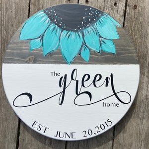 Family established name sign with sunflowers