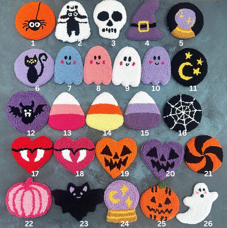 May include: A collection of twenty-six Halloween-themed coasters. Designs include a spider, ghost, skull, witch hat, crystal ball, black cat, bats, candy corn, spiderweb, jack-o'-lanterns, and ghosts. The coasters are made of a textured material.