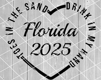 May include: Black and white graphic design with a heart shape. The text reads "Drink in my sand toes in the sand Florida 2025".