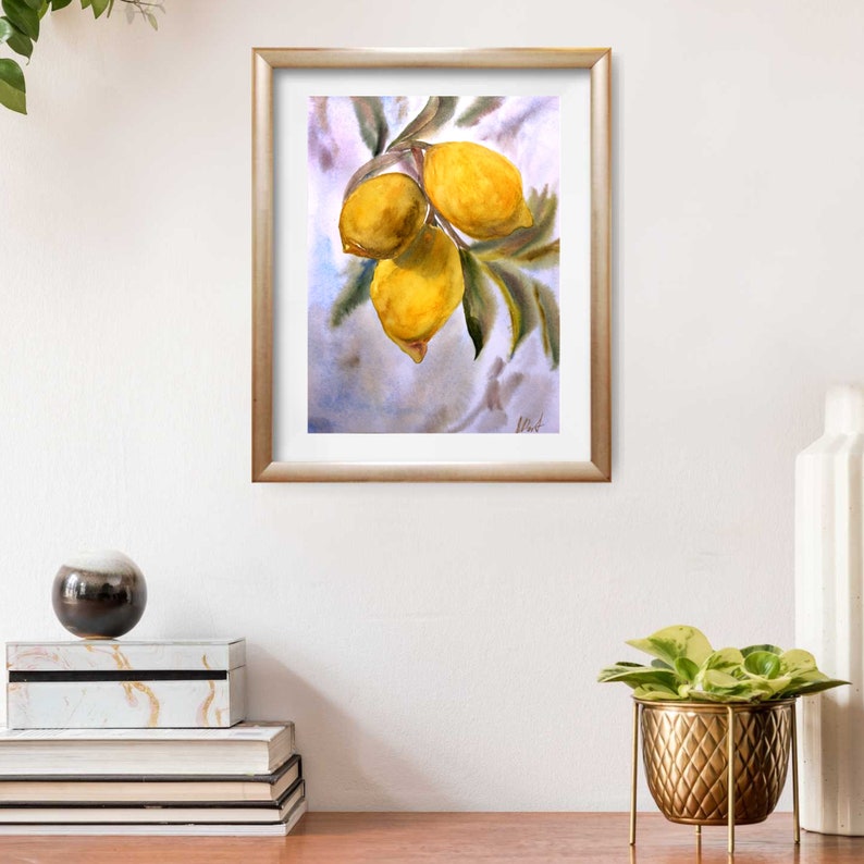 May include: Watercolor painting of three yellow lemons on a branch with green leaves. The lemons are hanging from the branch and are surrounded by a light blue background.