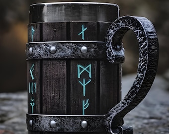 May include: A dark wooden beer stein with a metal handle and accents. The stein features teal-colored runic symbols and metal bands. The handle has a textured, forged appearance. The overall design has a rustic, Viking-inspired aesthetic.
