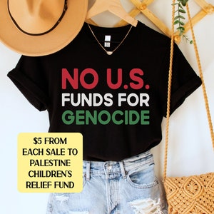 A black unisex crew neck short sleeve t-shirt with red, white, and green text that says "No U.S. funds for genocide"