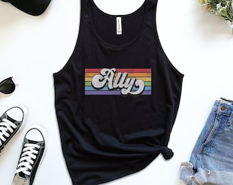 May include: Black tank top with a rainbow stripe design and the word "Ally" in a retro font.