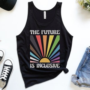 May include: Black tank top with a rainbow sun graphic and the text "The Future is Inclusive".