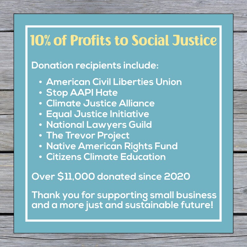 May include: A blue and white sign with the text "10% of Profits to Social Justice". The sign lists organizations that receive donations, including the American Civil Liberties Union, Stop AAPI Hate, Climate Justice Alliance, Equal Justice Initiative, National Lawyers Guild, The Trevor Project, Native American Rights Fund, and Citizens Climate Education. The sign also states that over $11,000 has been donated since 2020.