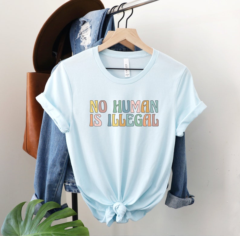No Human is Illegal Shirt, Immigrant Rights TShirt, Social Justice Gift, Support Dreamers Tee, Antiracist Clothing, Human Rights Protest Top Heather Ice Blue