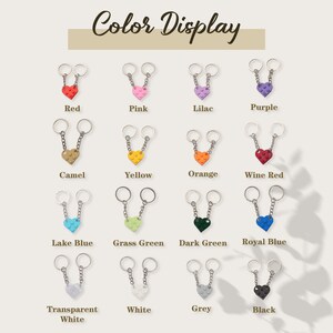 May include: Color display of 16 different keychain designs. Each keychain features two connected rings and a heart-shaped charm made of plastic LEGO bricks. The charms are available in a variety of colors, including red, pink, lilac, purple, camel, yellow, orange, wine red, lake blue, grass green, dark green, royal blue, transparent white, white, grey, and black.
