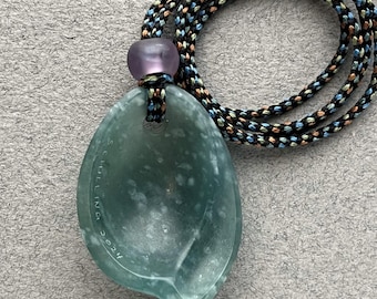 Hand carved jade pendant with amethyst beads and hand braided silk