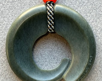 Spiral Loop, hand carved jade pendant with carnelian beads and hand braided silk