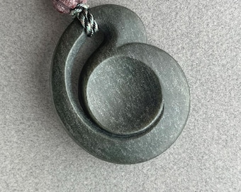Hand carved jade pendant, "Wood Grain Coriolis", Wyoming nephrite with jasper bead and hand braided silk
