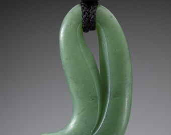 Hand carved apple green jade, "Pierced Magatama", with obsidian beads and hand braided silk
