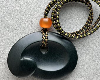 Hand carved Wyoming jade pendant with carnelian beads and hand braided silk