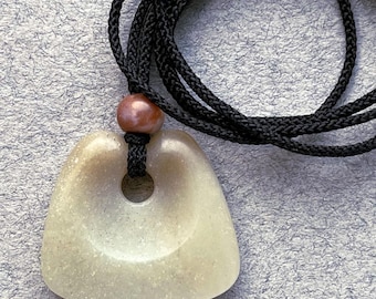 Off White Wedge Celt, hand carved jade pendant with jasper bead and machine braided silk