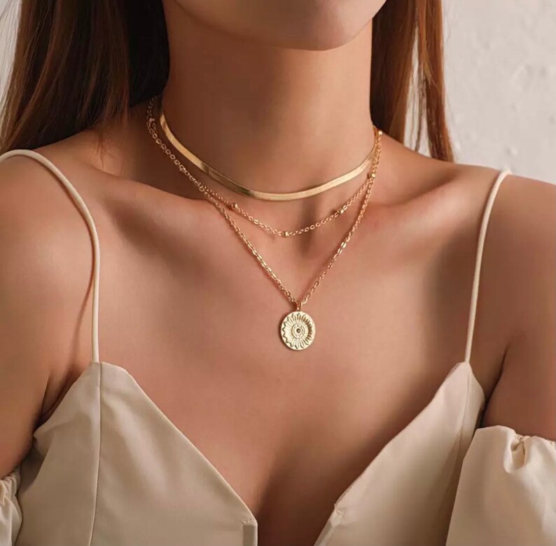 Multi-row lotus medal necklace, multi-row lotus medal necklace, boho multi-row necklace several models on Ateliersdisa lotus or 1
