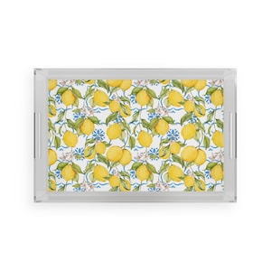 May include: Rectangular serving tray with a clear acrylic frame and handles. The tray features a vibrant lemon pattern with yellow lemons, green leaves, and white flowers on a white and blue background.