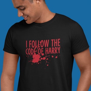 May include: A black t-shirt with red text that reads "I follow the code of Harry" with a red blood splatter design.