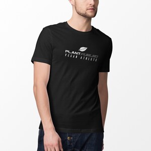 May include: A black t-shirt with a white graphic design that says "PLANT FUEL'D VEGAN ATHLETE" and a stylized leaf image.