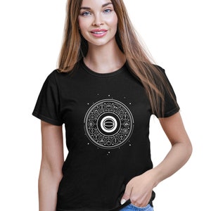 May include: Black t-shirt with a white graphic of a circle with various symbols inside. The circle is surrounded by a ring of smaller symbols.