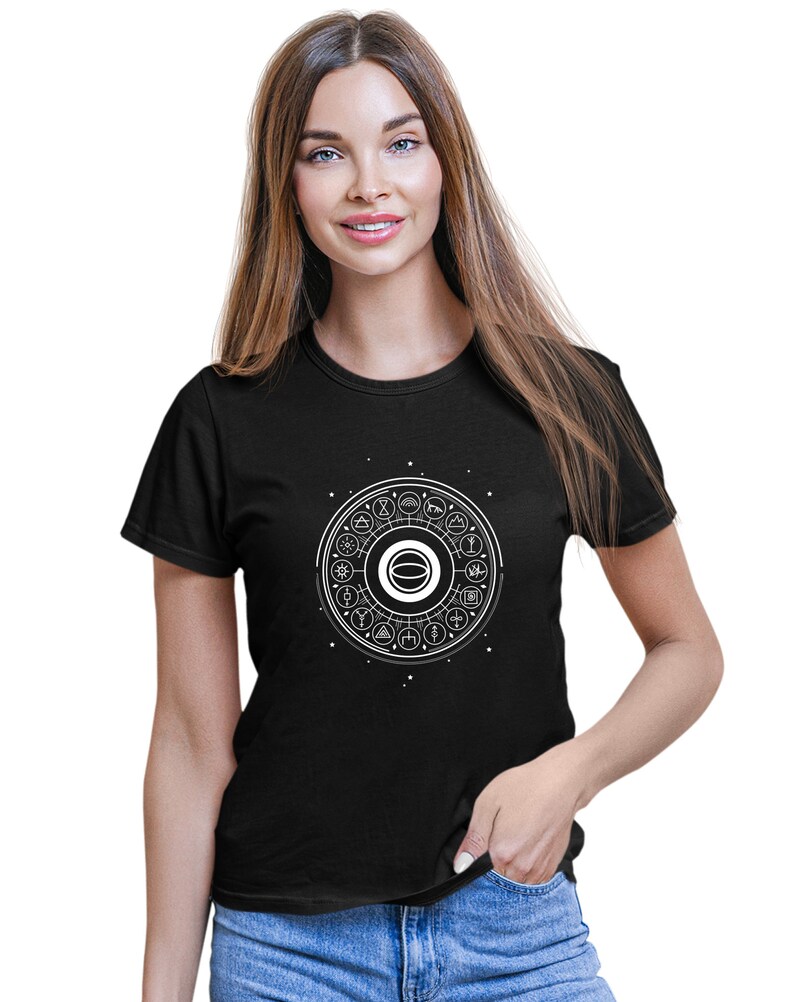 May include: Black t-shirt with a white graphic of a circle with various symbols inside. The circle is surrounded by a ring of smaller symbols.