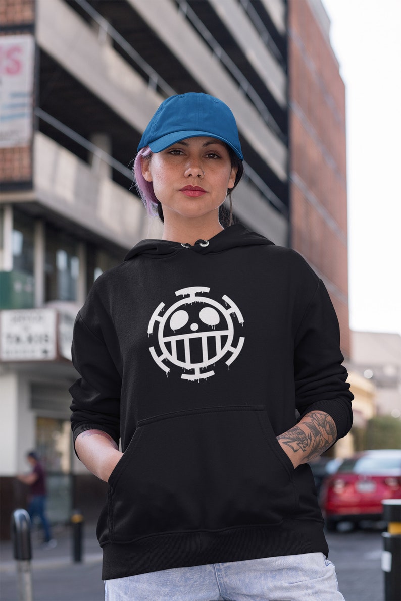 May include: A black hoodie with a white skull and crossbones design. The design is a symbol from the popular anime series One Piece.
