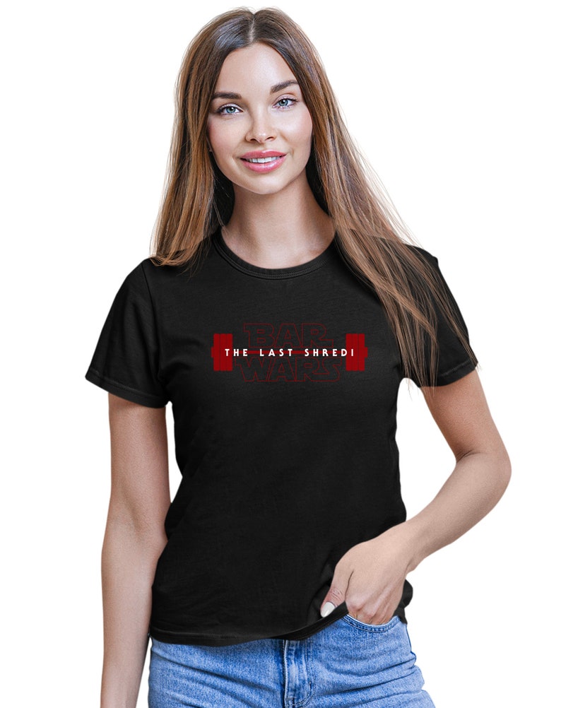May include: Black t-shirt featuring the red text "BAR WARS THE LAST SHREDI" and a barbell graphic. The shirt has a crew neck design.
