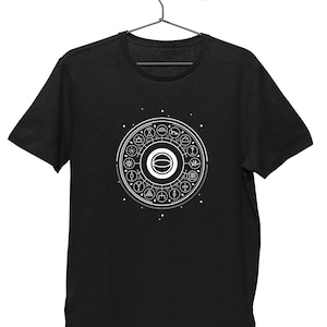 May include: A black t-shirt with a white graphic of a circle with symbols around it. The symbols include a sun, a moon, a tree, a mountain, and a star.