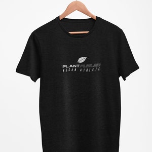 May include: Black t-shirt with a white leaf graphic and the text "PLANT FUELED VEGAN ATHLETE" printed on the front.