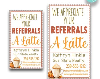 May include: Two printable business card designs with a fall theme. The cards feature a latte with whipped cream and a pumpkin. The text reads "We appreciate your referrals a latte".