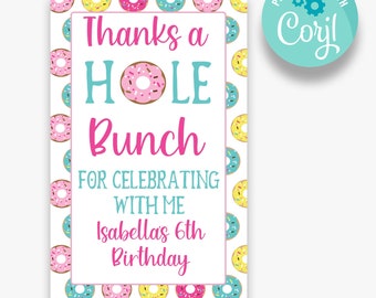 May include: A white thank you card with a donut pattern. The text reads "Thanks a HOLE Bunch for celebrating with me Isabellas 6th Birthday".