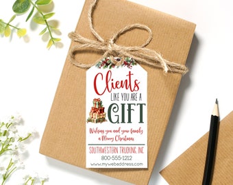 May include: A white gift tag with a red and green Christmas design. The tag says "Clients like you are a gift" and "Wishing you and your family a Merry Christmas". It also includes the company name "Southwestern Trucking, Inc." and contact information.