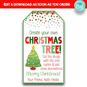 May include: A green Christmas tree cookie cutter with a red star on top. The text reads "Create your own CHRISTMAS TREE! Cut the dough with the tree cutter & add some decorations! Merry Christmas! Your Friend, Katie Hinkle".