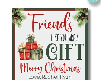 May include: A square Christmas card design with a white background, featuring red text that reads "Friends like you are a gift, Merry Christmas." The card includes watercolor illustrations of wrapped gifts and pine branches.