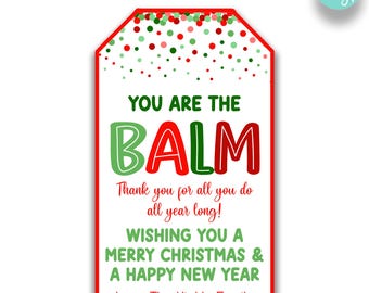 May include: Red and green Christmas gift tag with white polka dots. The tag says "You are the Balm" and "Thank you for all you do all year long! Wishing you a Merry Christmas & a Happy New Year. Love, The Hinkle Family."